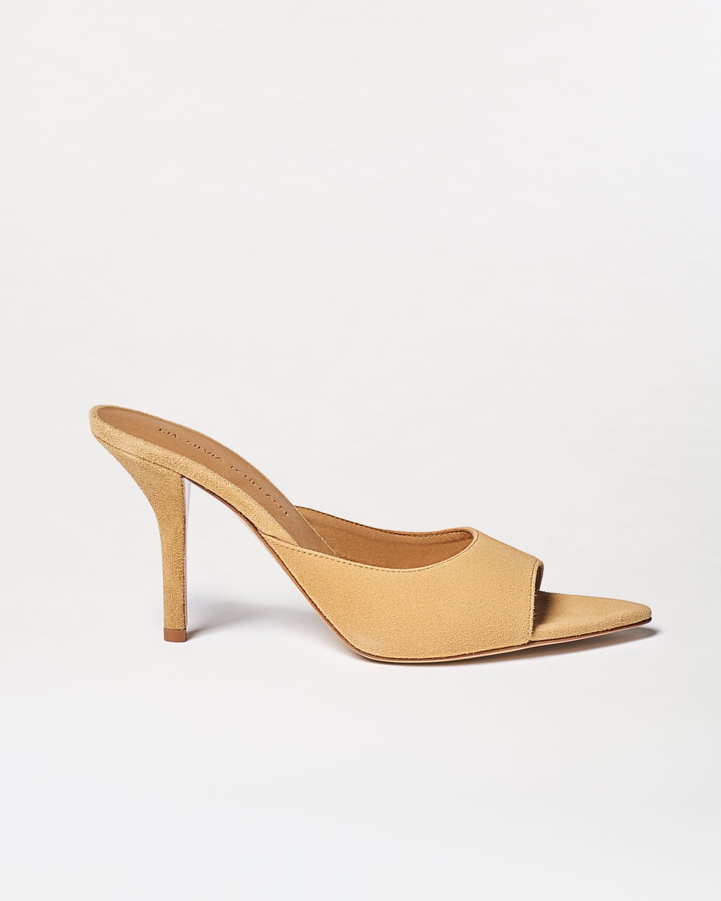 The Perni Heels are beige mule sandals featuring an open toe, slip-on design, and suede finish, shown on a plain white background.