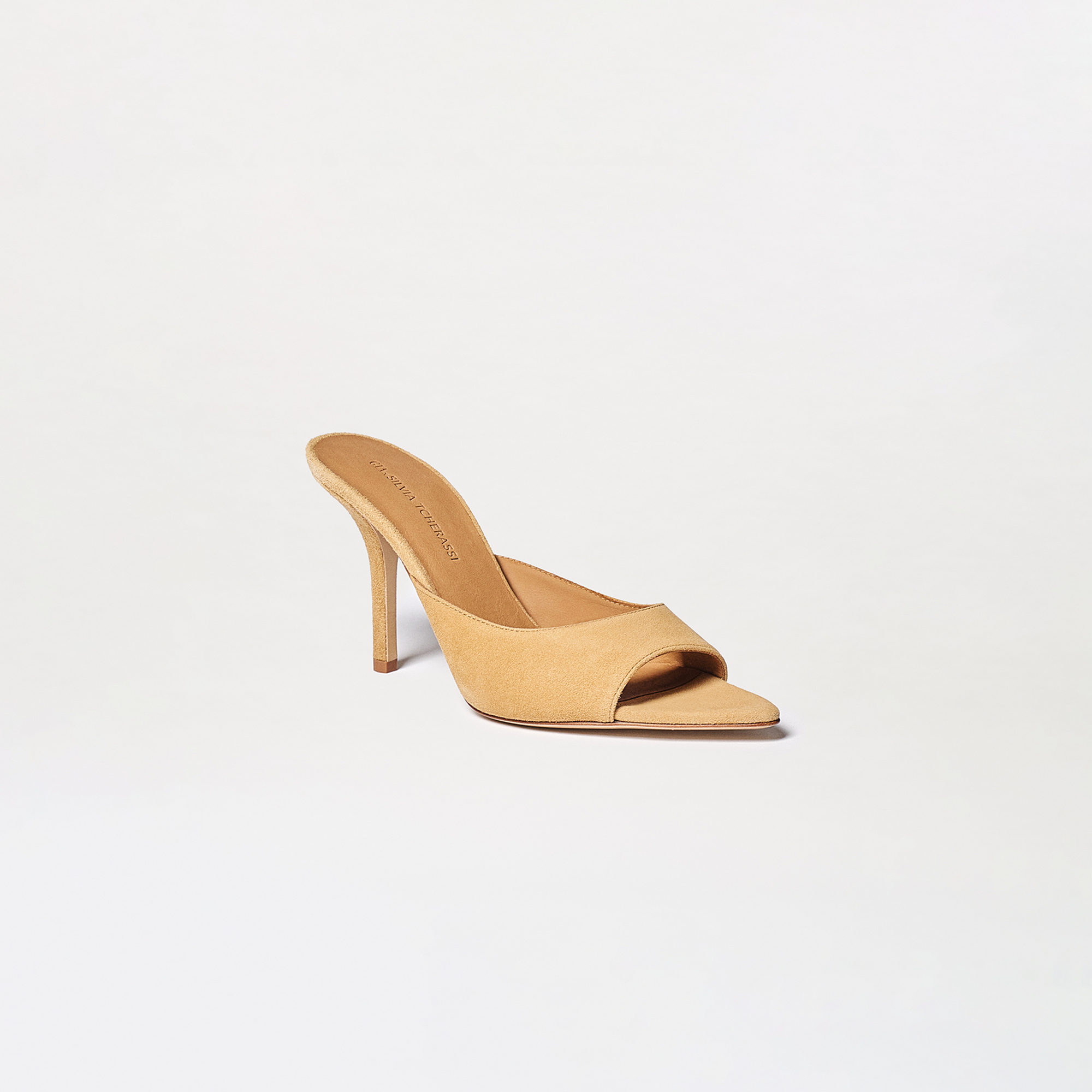 The Perni Heels are tan mule sandals featuring an open toe and slim stiletto heel, shown against a light background.