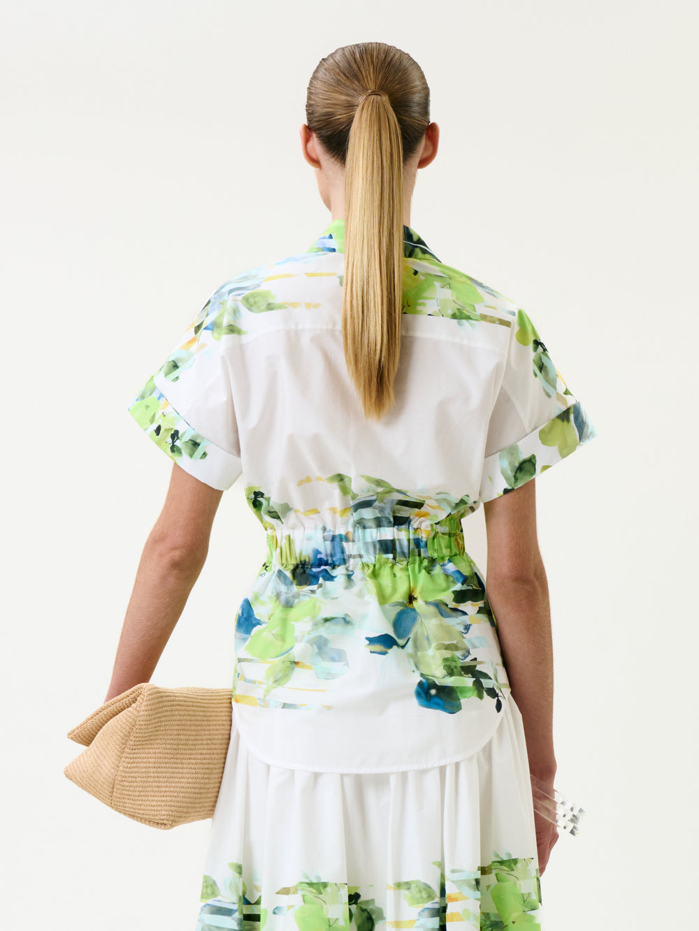 Woman wearing a floral dress with a white background