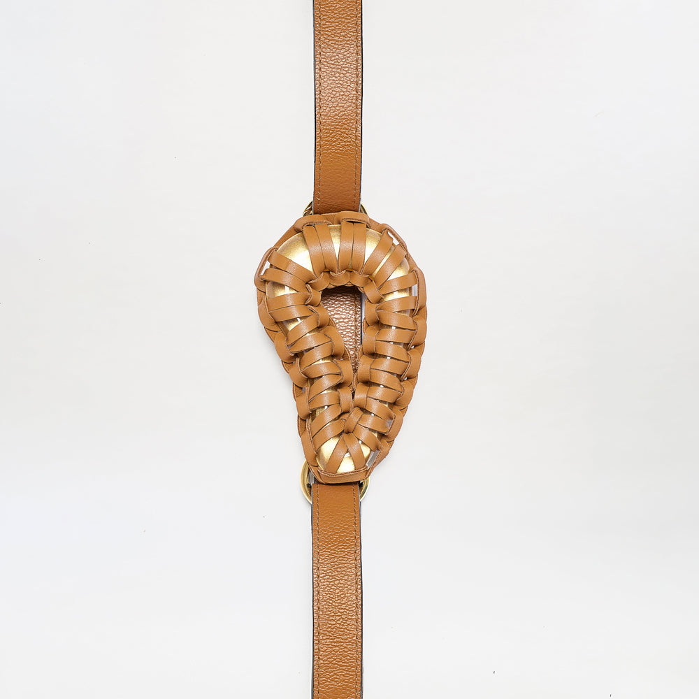 The Renata Belt features a brown leather strap with an intricately woven, oval-shaped padded center, displayed against a plain white background.