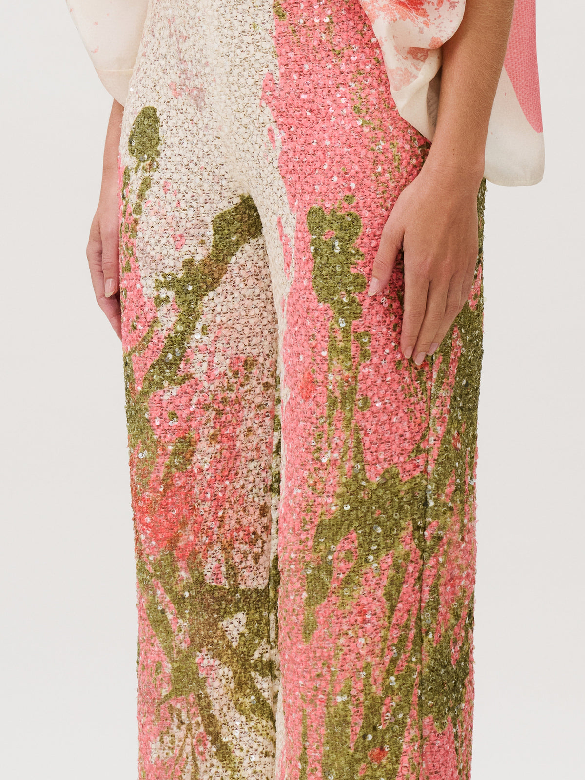 Como Pant wide-leg sequin pants featuring a pink and olive green abstract pattern, crafted from Italian fabric.
