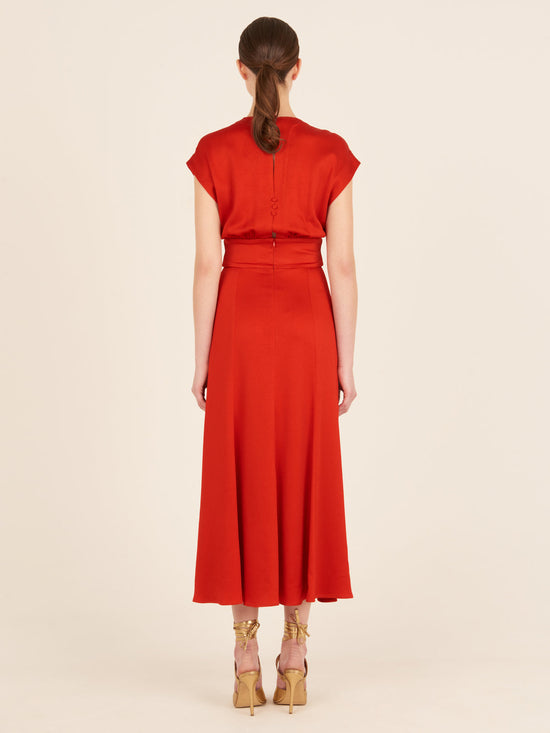 Emmeline Dress Rouge, with a belt that features a plunging neckline.