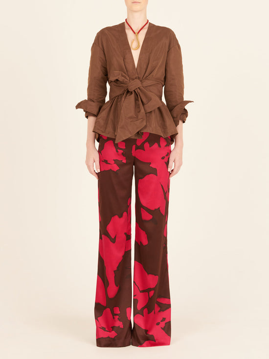 A woman's pink and brown Andie Pant Fuchsia Cacao with a high-waisted silhouette.