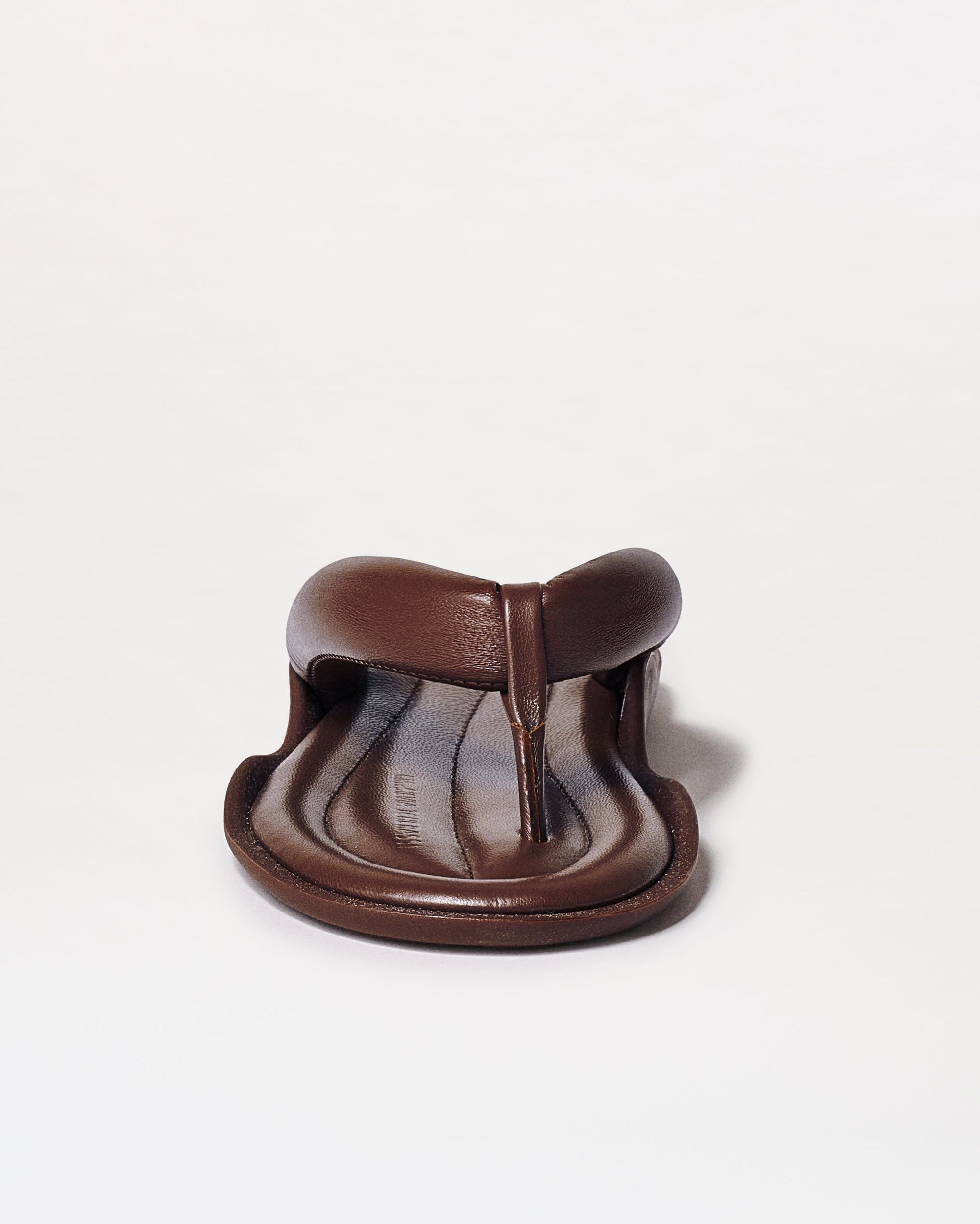 Front view of Harper Sandals in brown leather, featuring a cushioned footbed and toe loop design, displayed against a plain white background.