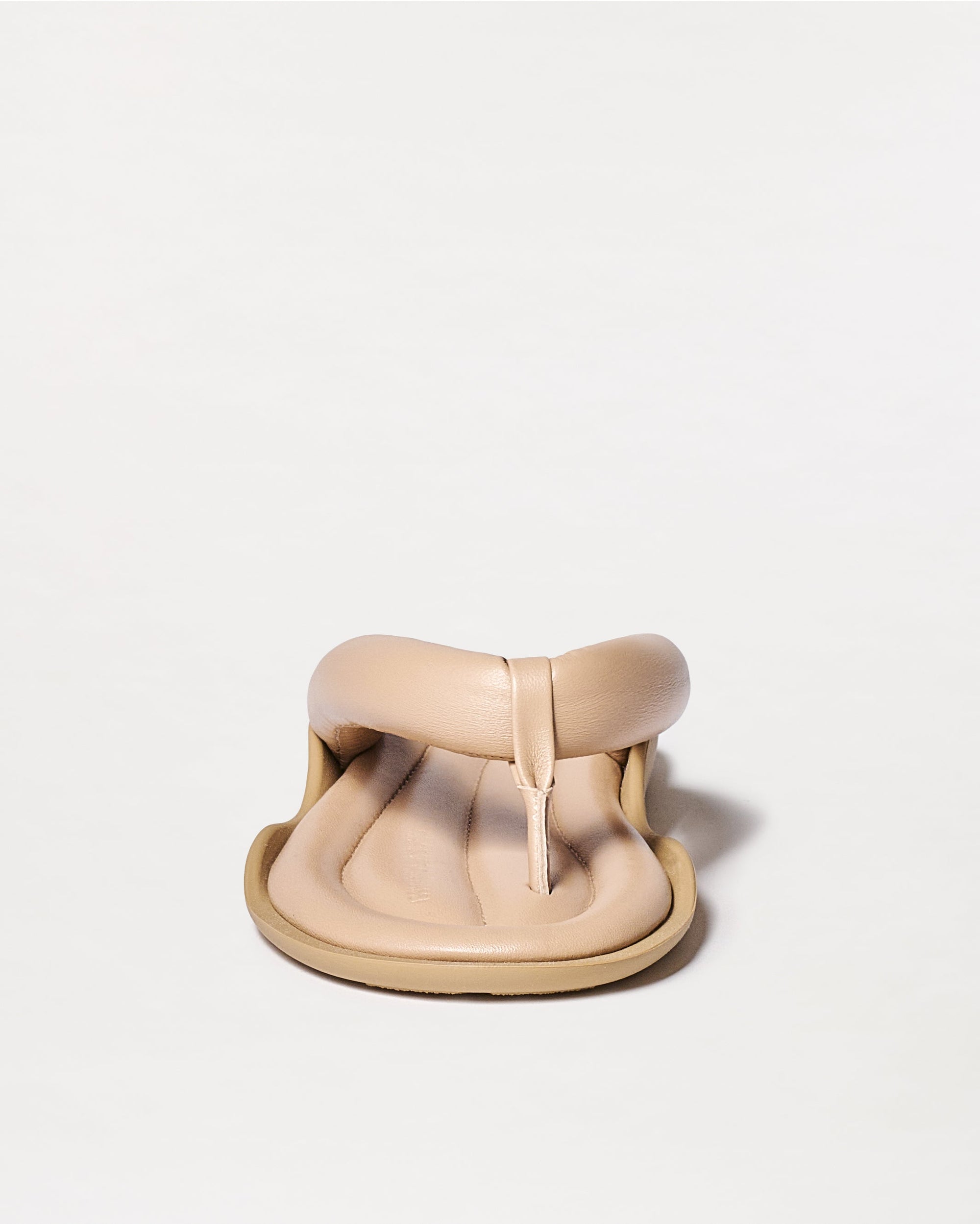 Beige sandal on a white background