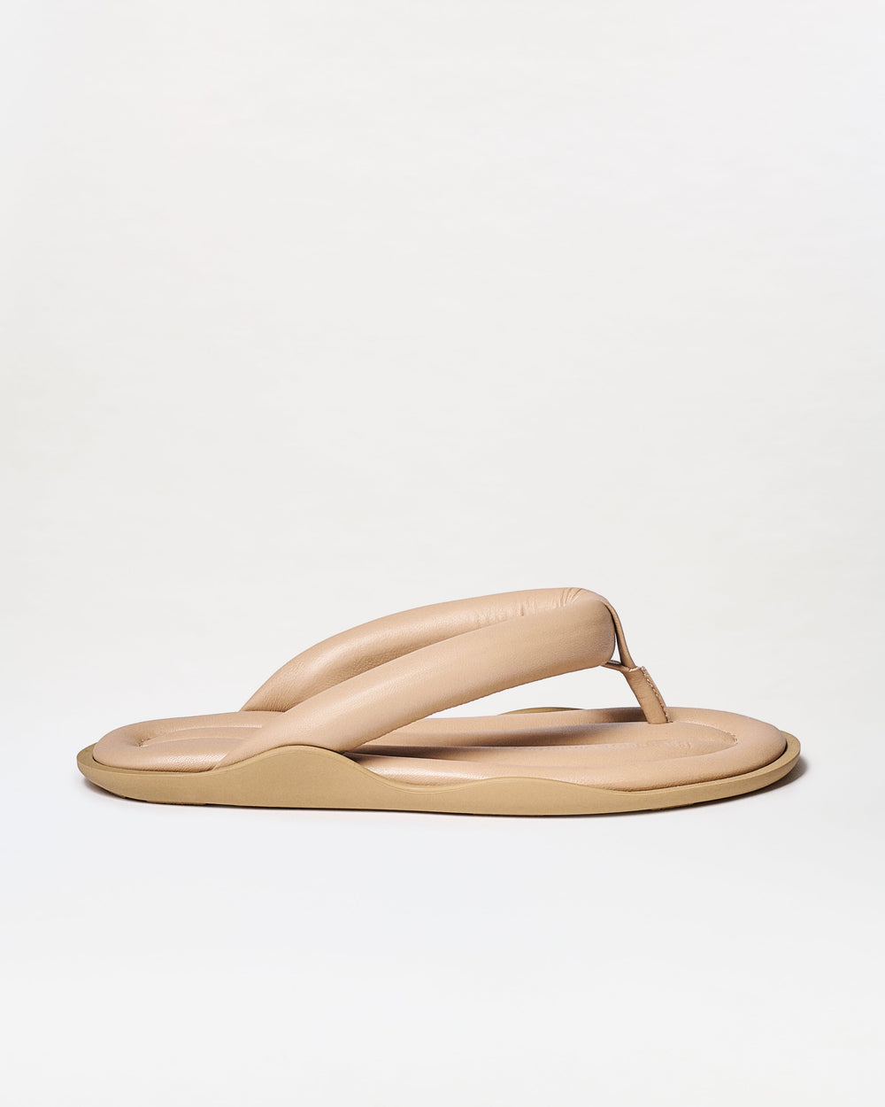 Beige sandal on a white background