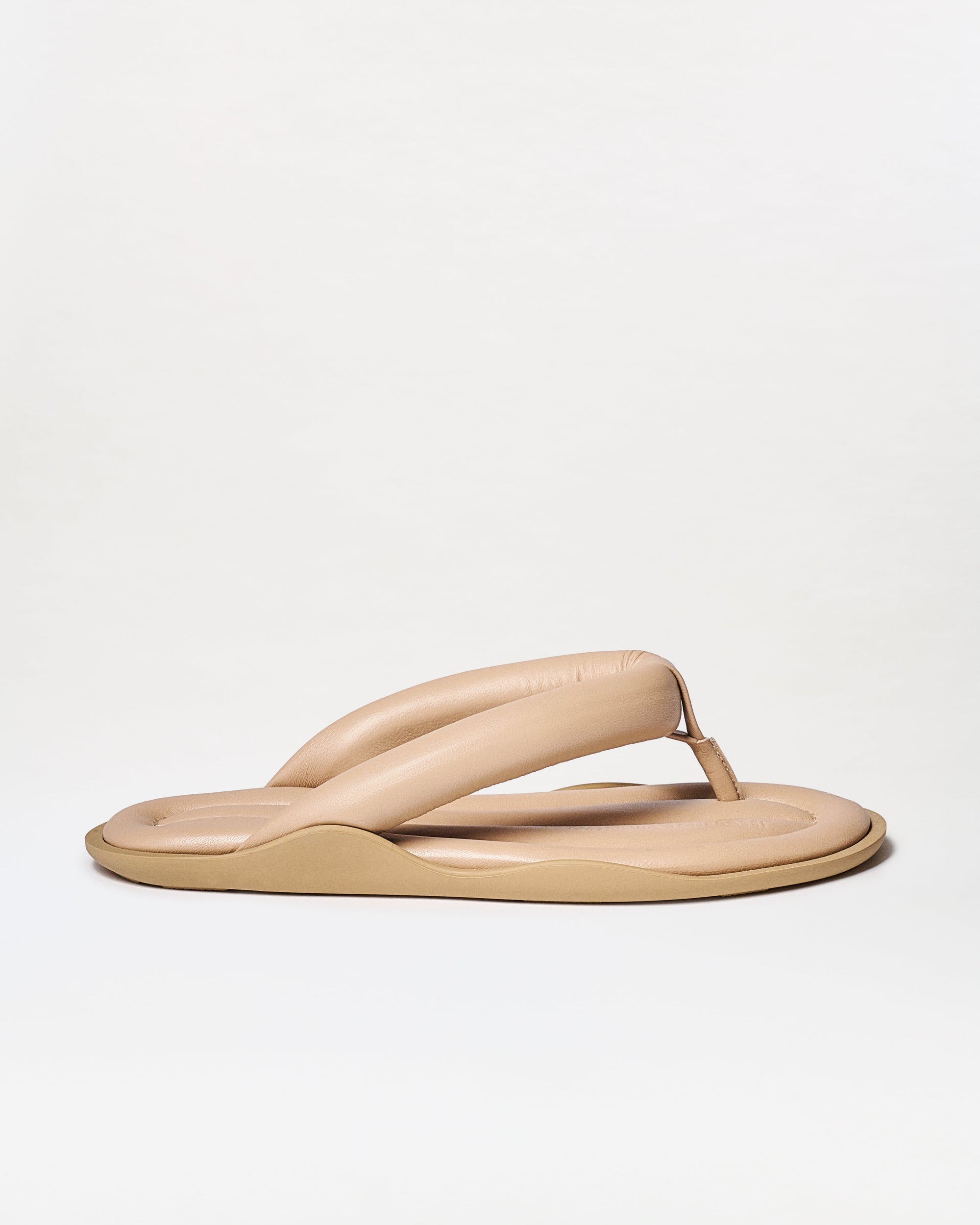 Beige sandal on a white background