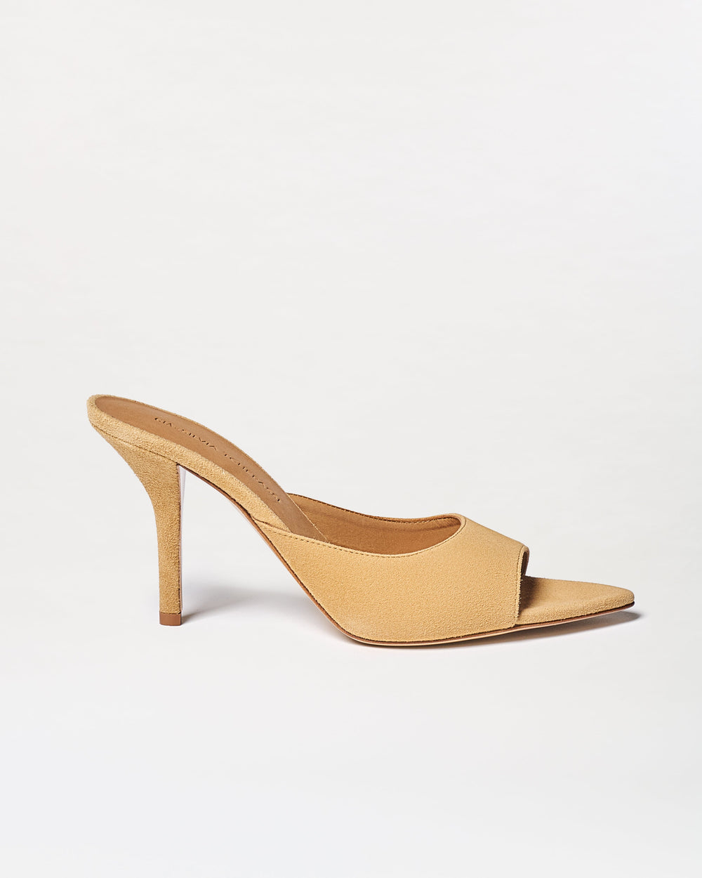 The Perni Heels are beige mule sandals featuring an open toe, slip-on design, and suede finish, shown on a plain white background.