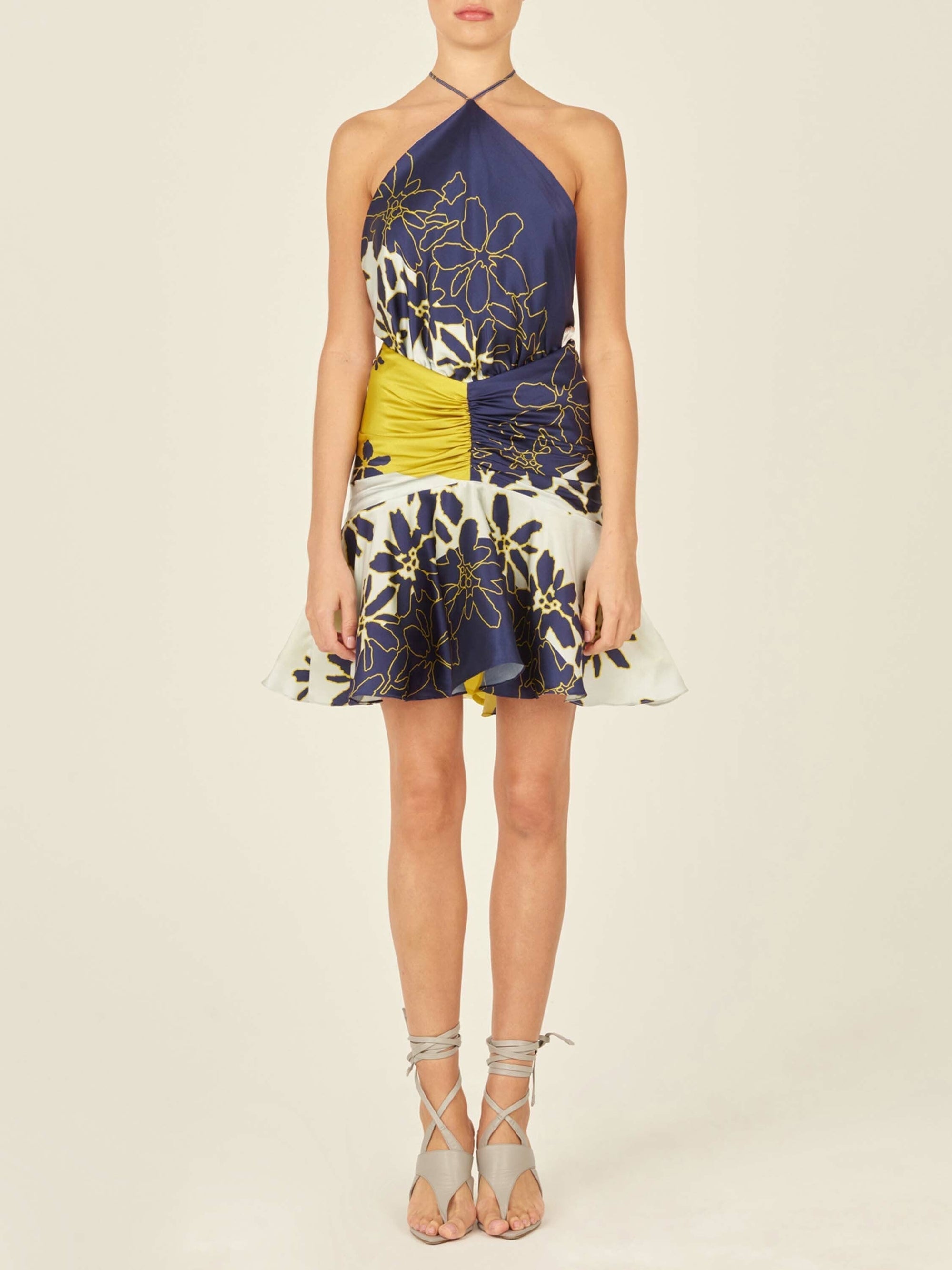 This Loriana Skirt Navy Citrine is made of floral fabric and features an invisible zipper.