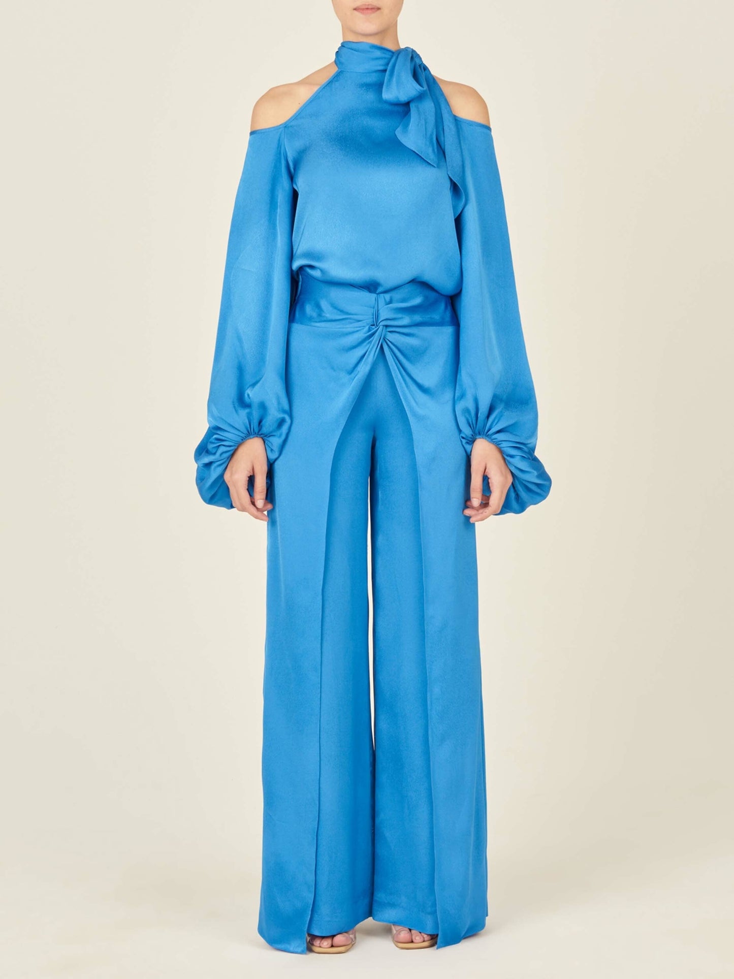 The Ludovica Blouse Blue with a bow on the shoulder, please allow one week for order to ship.