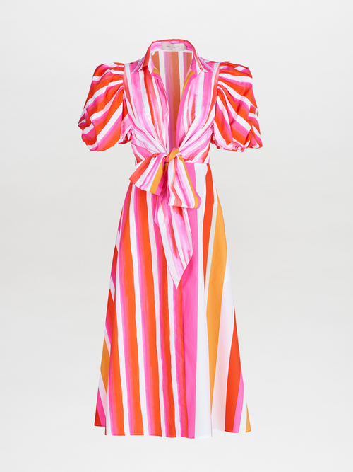 A Pavia Dress Rouge Orange Stripes with a brushstroke stripe print and a bow.