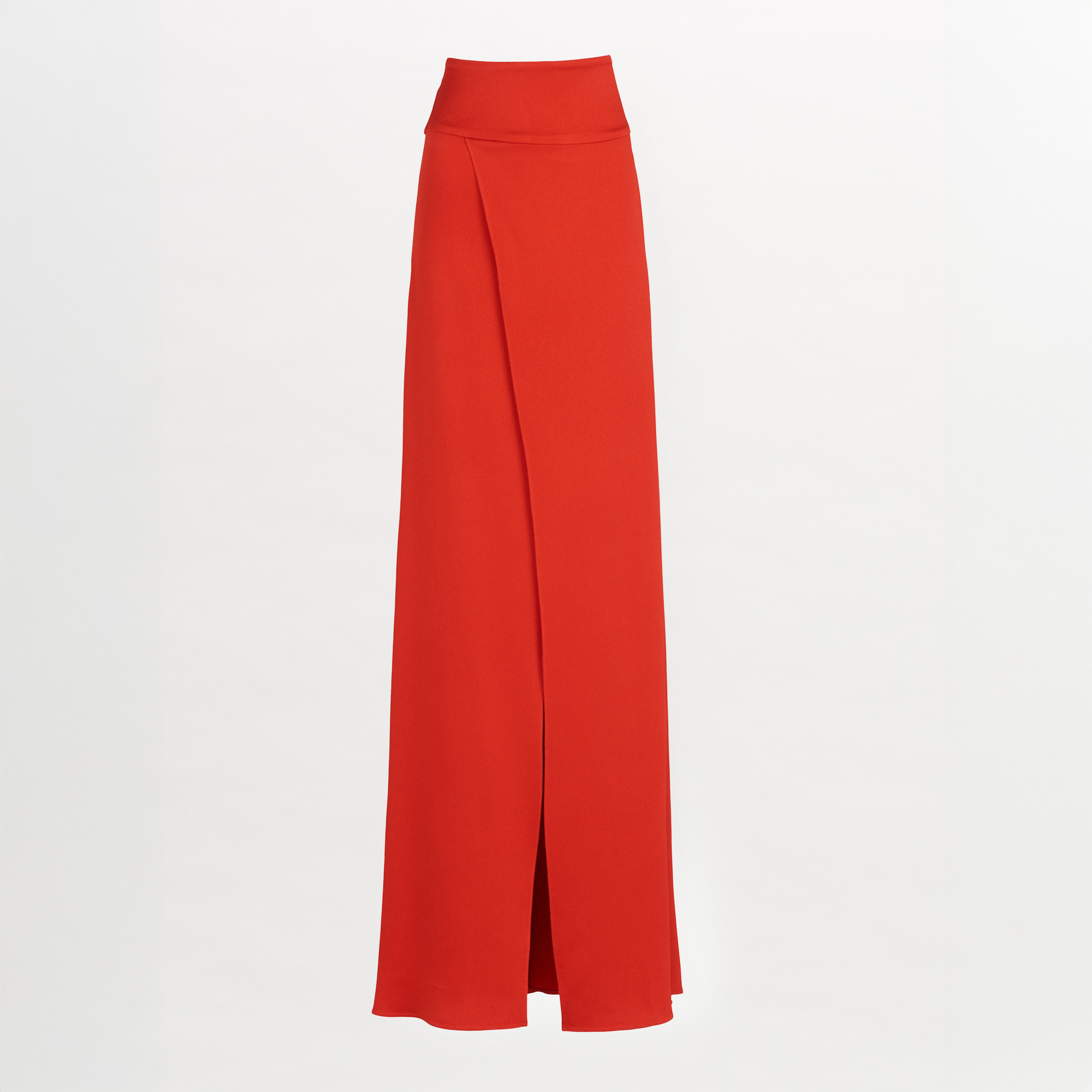 La Falda Pinar Rouge es una falda roja de cintura alta y larga hasta el suelo que presenta una cinturilla ancha, un cierre invisible y un detalle de superposición frontal, que se muestra sobre un fondo blanco liso.