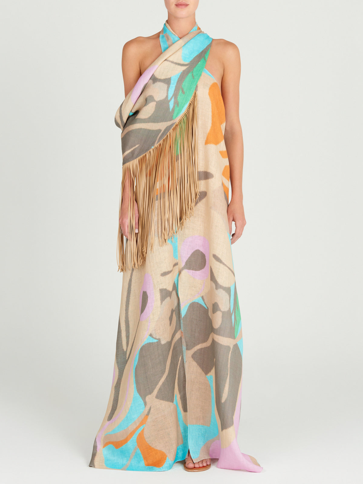 A Florence Tunic Pastel Multi Swirls with leather fringes on it.