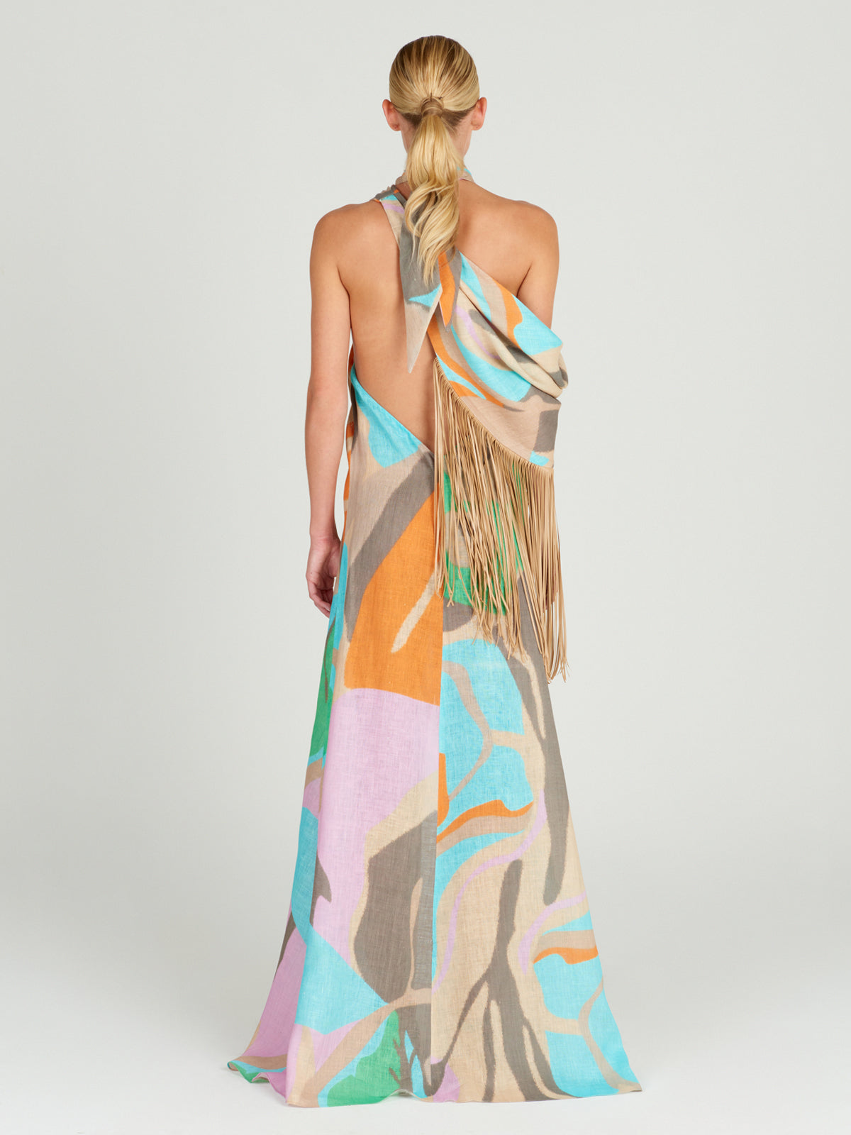 A Florence Tunic Pastel Multi Swirls with leather fringes on it.