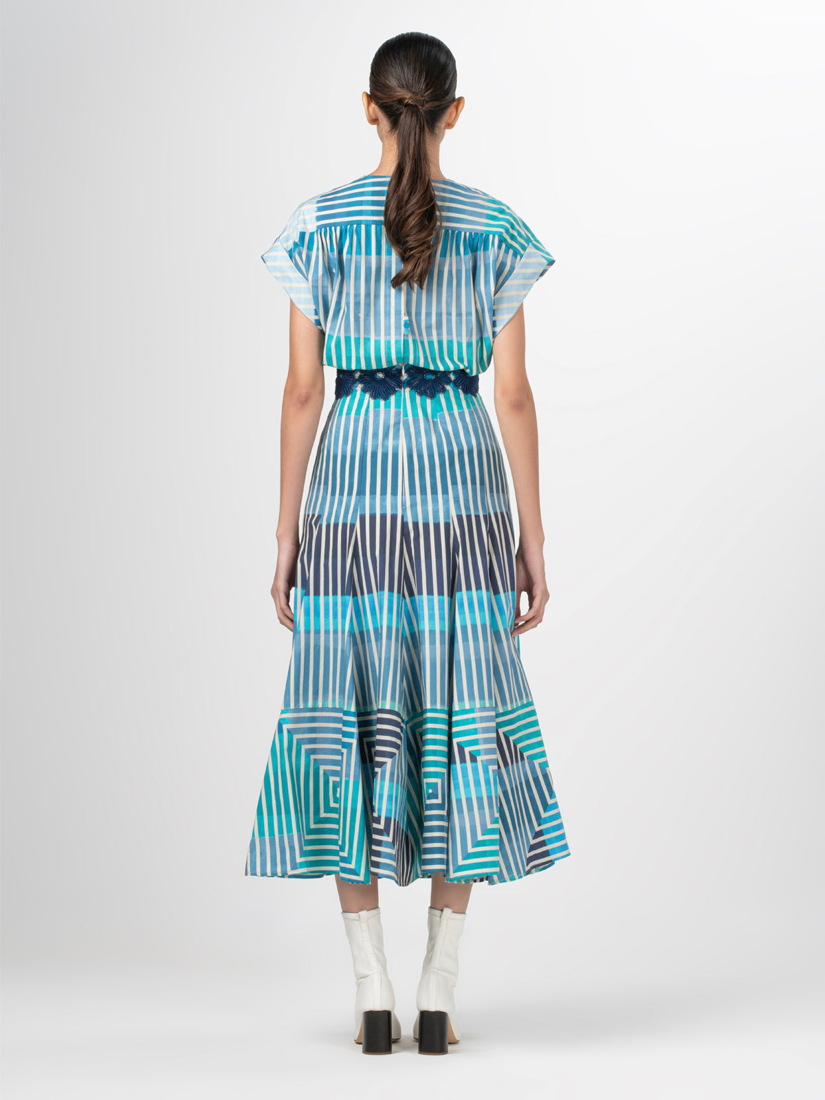 A Adila Dress Infinite Blue Stripes with a belt.