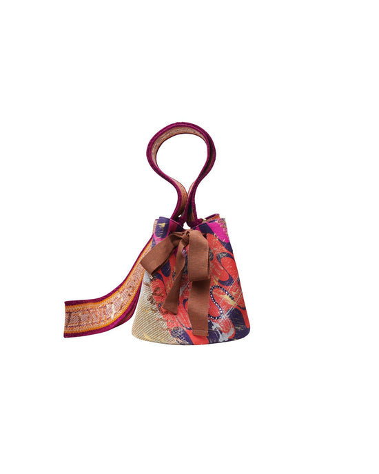 A Mochila Laaput Small Trinitaria handbag with a handle.