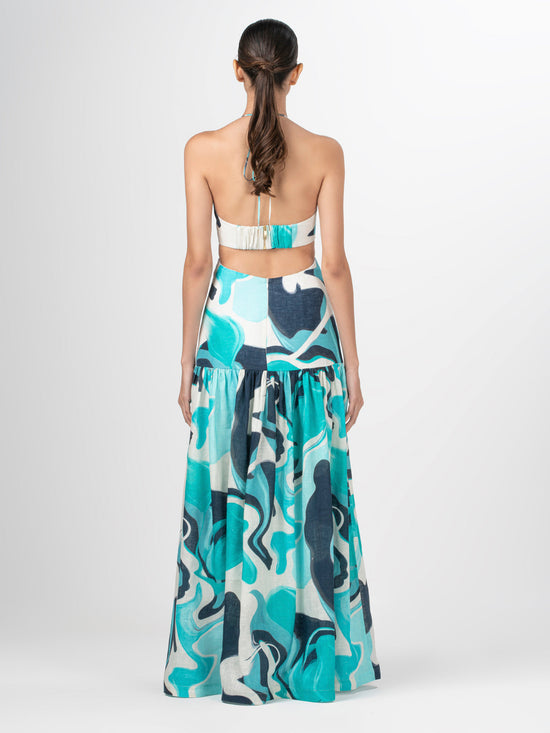 A Rosalia halter dress with an abstract print.